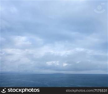 seascape with cloudy sky over blue sea