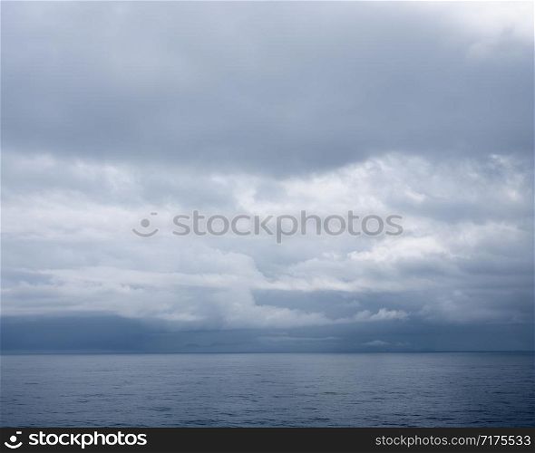 seascape with cloudy sky over grey sea