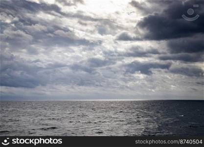 seascape with dark clouds and light