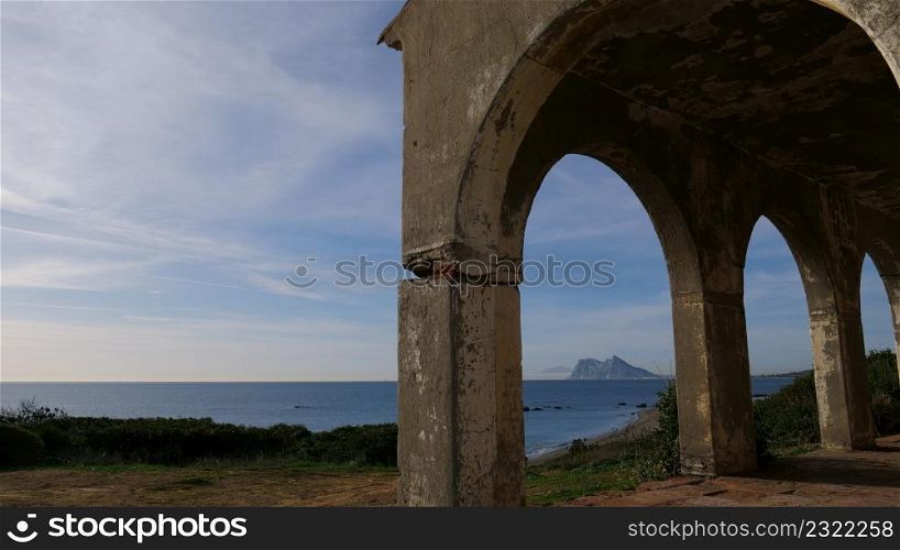 Seascape with Gibraltar rock on horizon. View from Torrecarbonera beach, Punta Mala, Andalusia Spain.. Seascape and Gibraltar rock on horizon