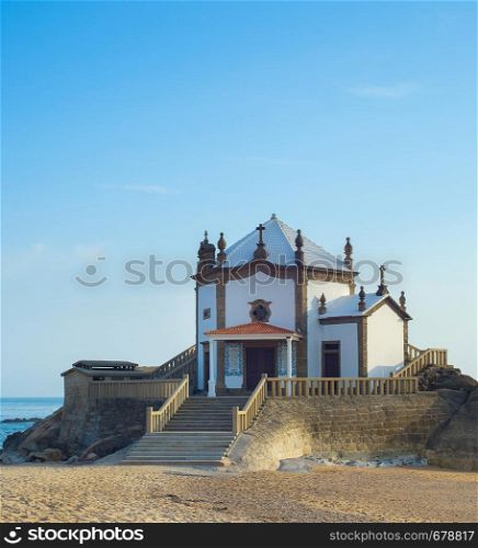 Seascape with Senhor da Pedra chapel at Miramar beach, Portugal