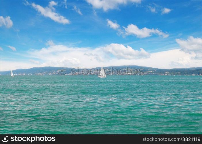 seascape with turquoise waters and sailing vessel