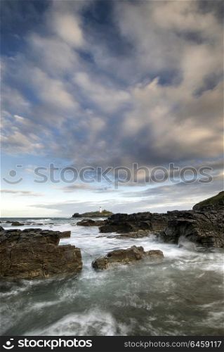 Seascapes. Landscape view of Godrevy lighthouse in Cornwall during beautiful sunrise