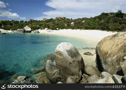 Seashore flanked by rocks, Virgin Gorda, Virgin Islands