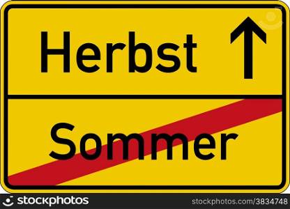 Season change. The German words for summer and autumn (Sommer and Herbst) on a road sign