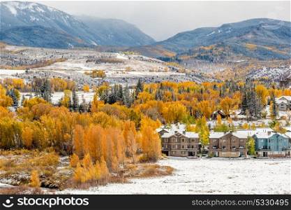 Season changing, first snow and autumn trees. Rocky Mountains, Colorado, USA.