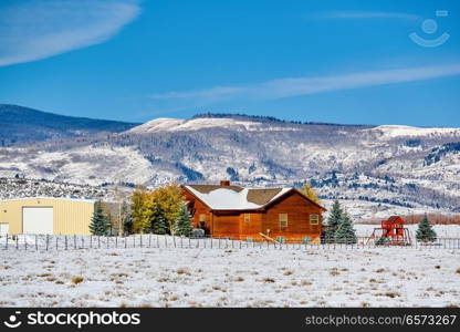 Season changing, first snow on roof. Rocky Mountains, Colorado, USA. 