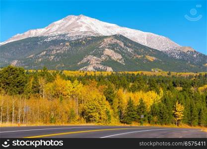 Season changing from autumn to winter. Highway in Colorado, USA. 