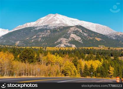 Season changing from autumn to winter. Highway in Colorado, USA. 