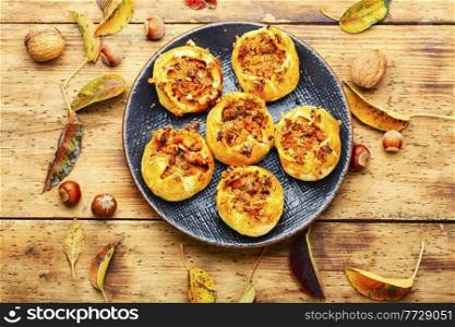 Seasonal delicious buns stuffed with autumn pumpkin and meat. Autumn fresh buns or pumpkin pie