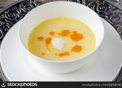 Seasoned fish soup on a white porcelain plate