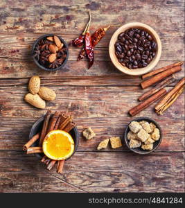 Seasoning for coffee from cinnamon,star anise and almonds on the vintage background
