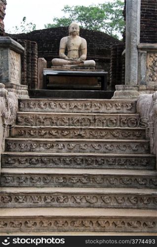Seated Buddha and staircase in vatadage in Polonnaruwa, Sri Lanka