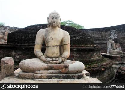 Seated Buddhas and stupa in vatadage in Polonnaruwa, Sri Lanka