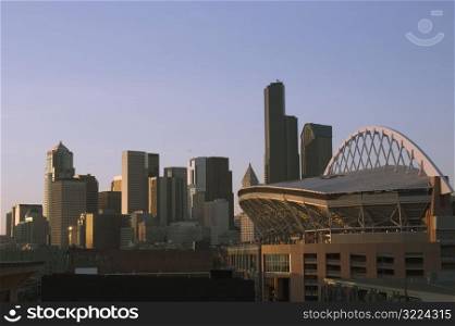 Seattle Cityscape With Stadium At Sunset