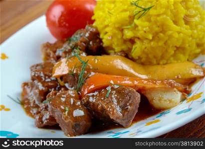 Seco de Chivo - Secos are thick Ecuadorian stews, usually served with yellow rice and fried plantains