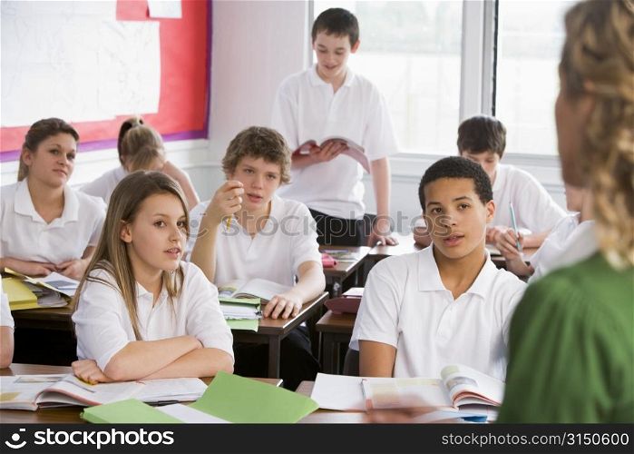 Secondary school student reading out loud in classroom