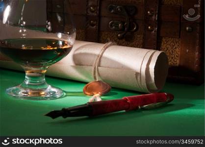 secret scroll with a wax seal and a glass of cognac on the green baize