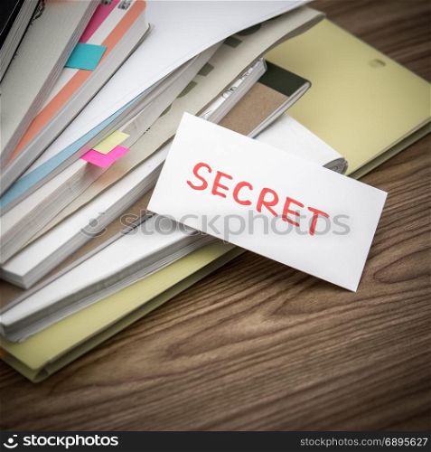 Secret; The Pile of Business Documents on the Desk