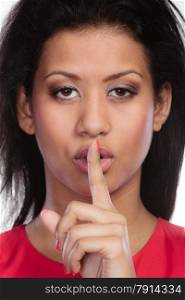 Secret woman finger on lips. Teen girl mixed race showing hand silence sign, saying hush be quiet