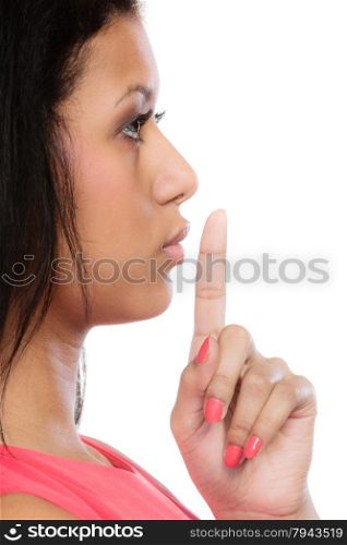 Secret woman finger on lips. Teen girl mixed race showing hand silence sign, saying hush be quiet. Face profile isolated on white