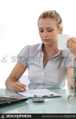 Secretary filling in paperwork