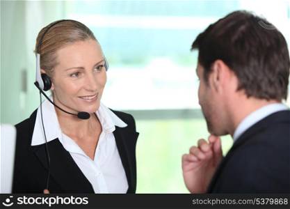 Secretary giving information to boss