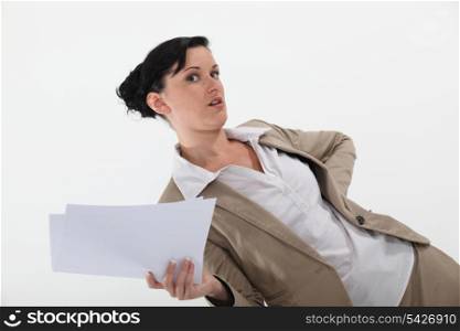 Secretary holding paperwork