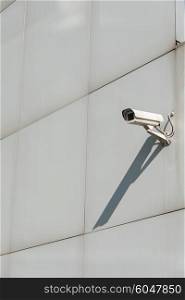 Security camera attached to the wall