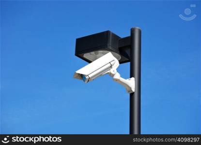 Security camera placed in a street lamp.