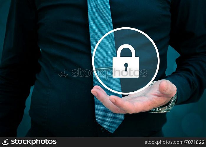security concept, businessman holding lock in his hand.. security concept, businessman holding lock in his hand