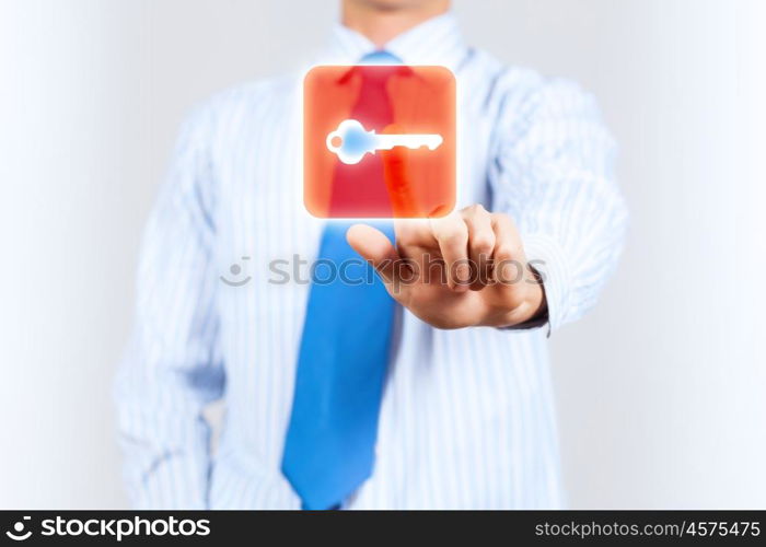 Security concept. Close up of businessman touching icon on media screen