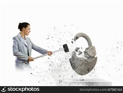 Security concept. Image of businesswoman crashing lock with hammer