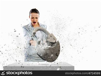 Security concept. Image of businesswoman crashing lock with hand