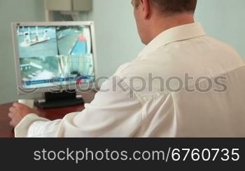 Security guard in control room at CCTV