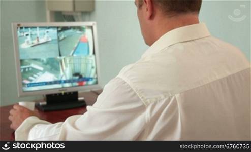 Security guard in control room at CCTV