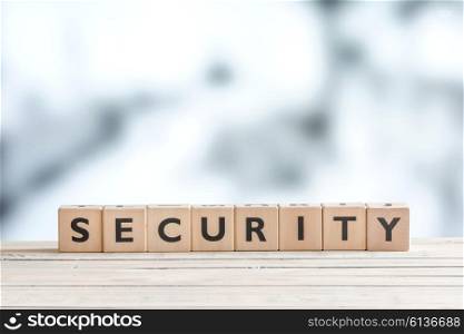 Security sign made of wooden cubes on a table