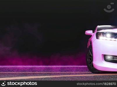 Sedan car and pink smoke on the asphalt road at night,copy space