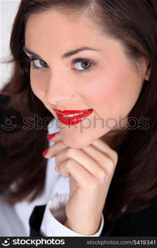 Seductive brunette with bright red lipstick