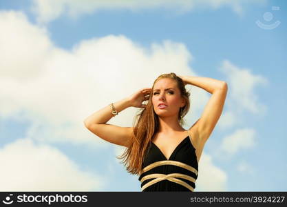 Seductive woman summertime vacation day. Georgeus girl on beach blue sky.