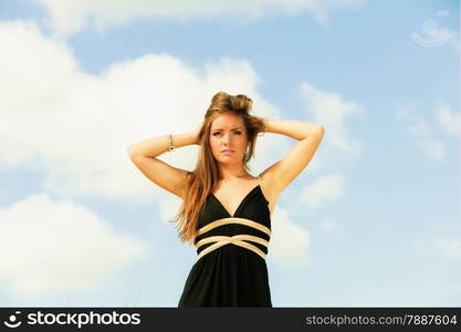 Seductive woman summertime vacation day. Georgeus girl on beach blue sky.