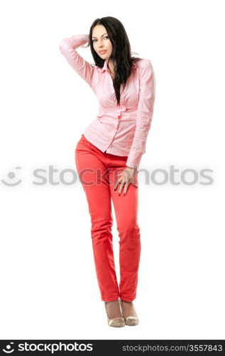 Seductive young brunette in red jeans. Isolated