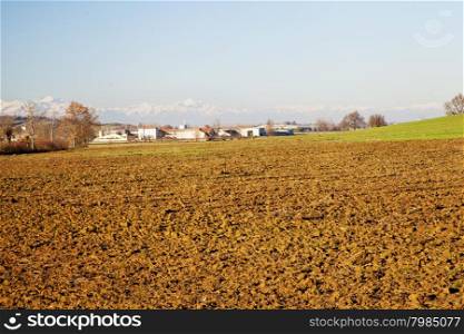 Seeded fields with mountains on the background, horizontal image
