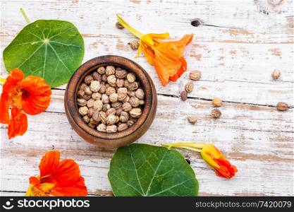 Seeds, leaves and flowers of nasturtium.Spice.Herbal medicine.. Nasturtium officinale with seeds