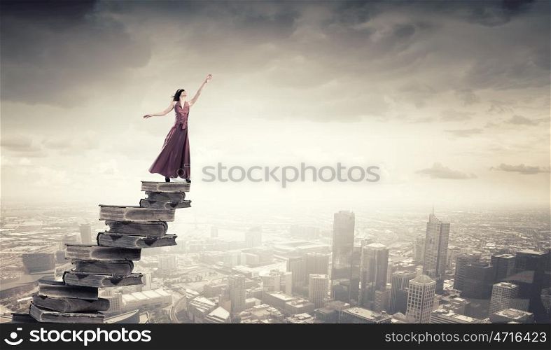 Seek for education and knowledge. Woman in long dress with blindfold on eyes and book in hand