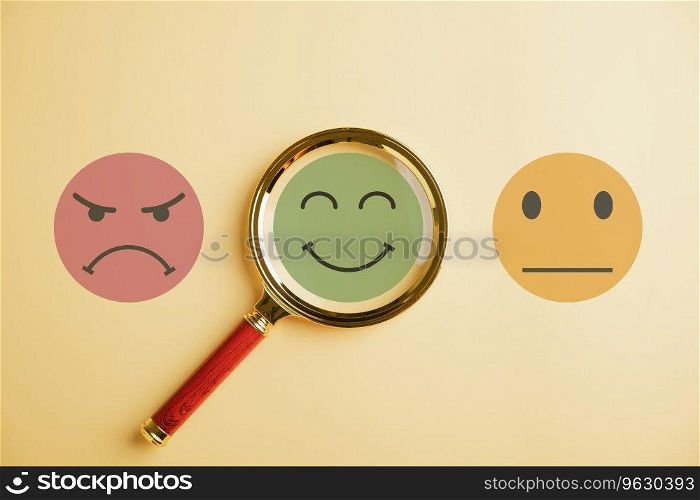 Seeking happiness smiley face icon under magnifying glass. Customer satisfaction and evaluation or marketing survey. Magnification, satisfaction, reputation, corporate, customer, emotion portrayed.