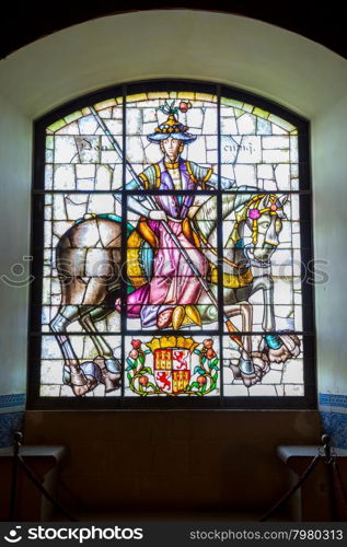 SEGOVIA, SPAIN - JUN 2: Stained glass in Hall of the Pine Cones in Alcazar of Segovia, Spain, depicting King Alfonso VIII of Castile and his daughter Berengaria on Jun 2, 2014.