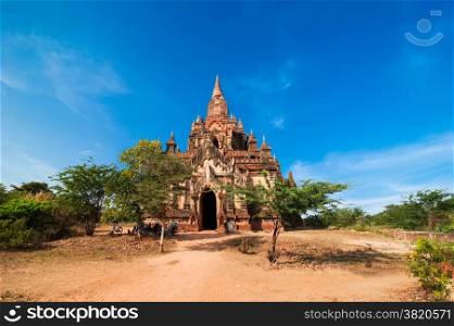 Seinnyet Ama Temple under blue sky. Amazing architecture of old Buddhist Temples at Bagan Kingdom, Myanmar (Burma) travel landscapes and destinations