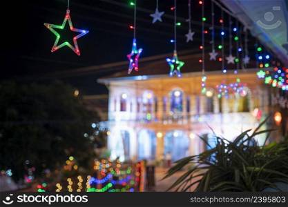 Select focus starlight and Christmas background in the Tha Rae village location Sakon Nakhon, Thailand.