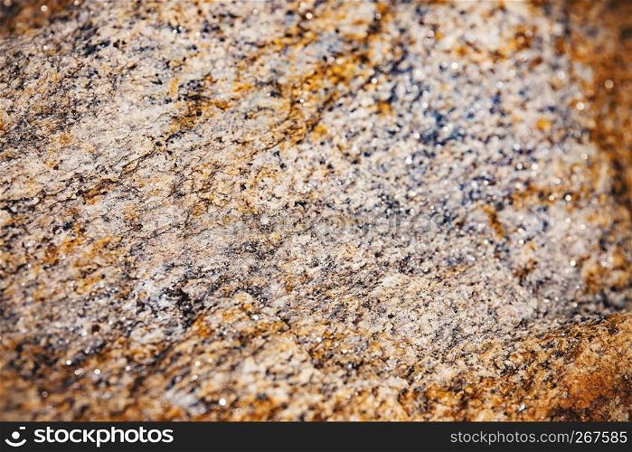 Selected focus at the center of rusty and dusty brown stone surface texture with blurry and vignette border, Abstract grunge nature background.